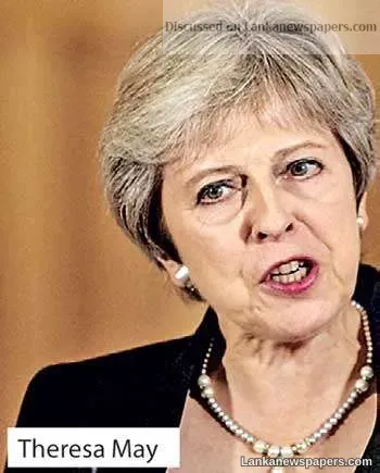May defends draft Brexit deal agreed by EU, Britain
