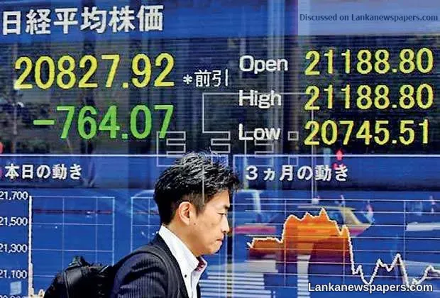 Asian markets edge higher at end of painful week