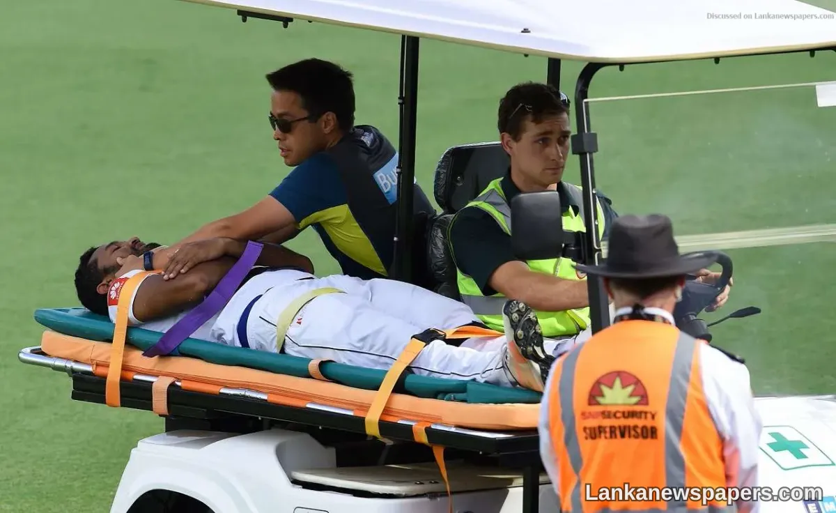 Karunaratne stretchered off as Sri Lanka chase big Australia total