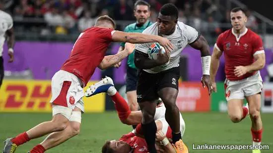 Brilliant Adams grabs hat-trick as battered Wales reach quarters