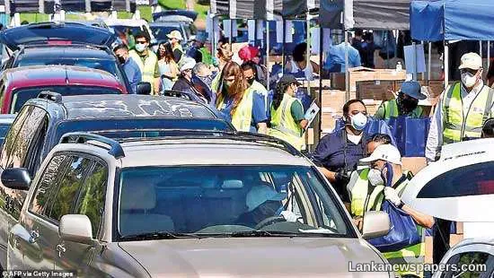 Hundreds of Americans line up for food bank handouts