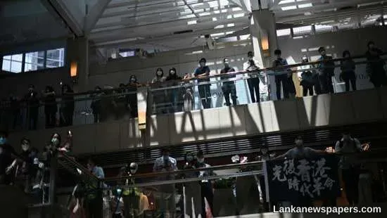 Police fan out, but Hong Kongers eschew rallies
