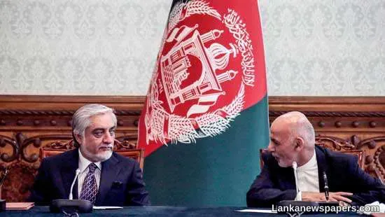 Afghan President Ghani and rival sign power-sharing deal