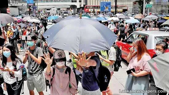 Hong Kong police arrest 300 as thousands protest over security laws