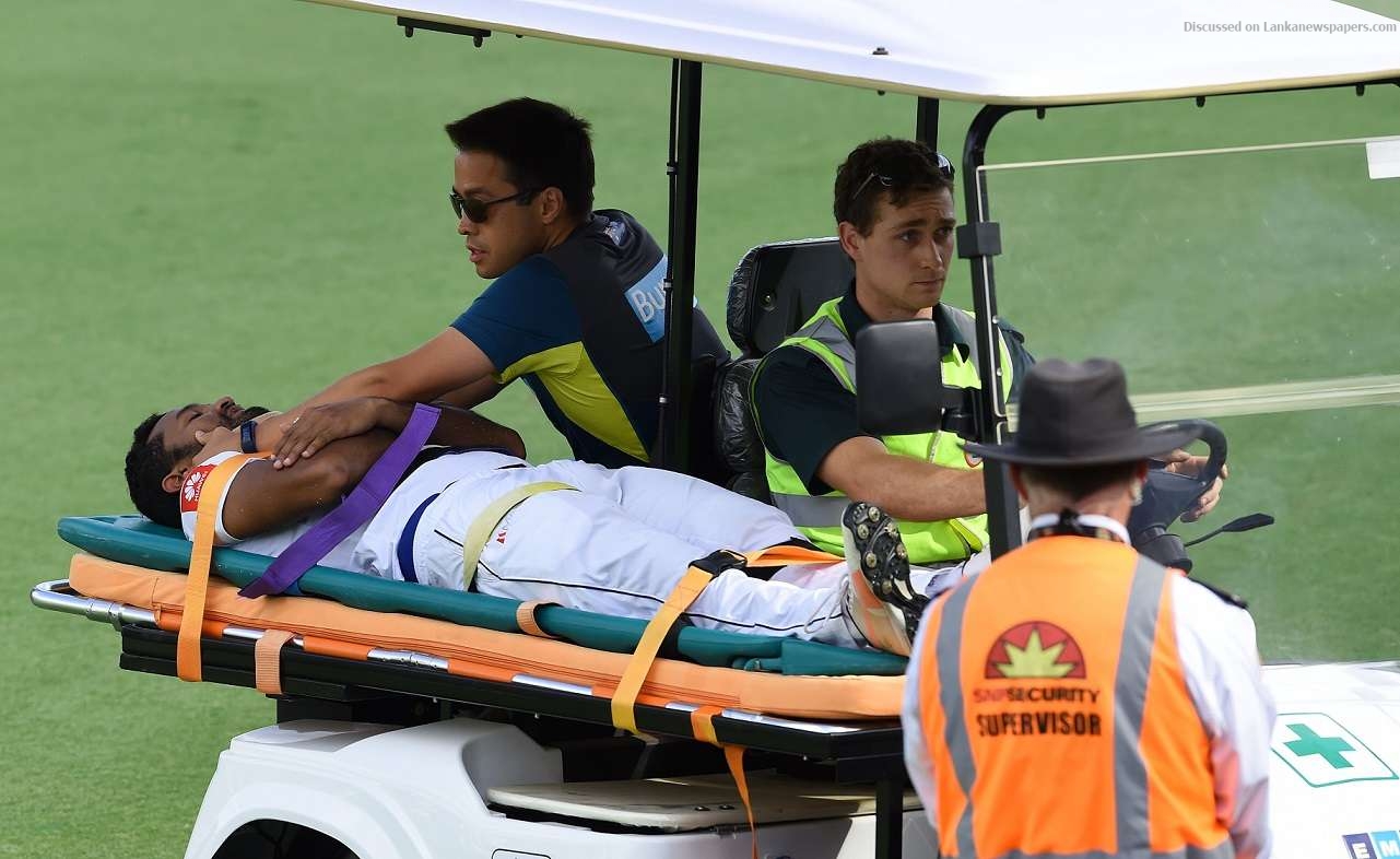 Karunaratne stretchered off as Sri Lanka chase big Australia total